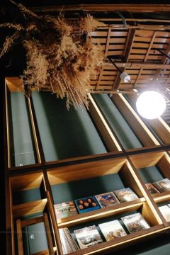 Dried plants hang from the ceiling at U.I.J Hotel & Hostel lobby