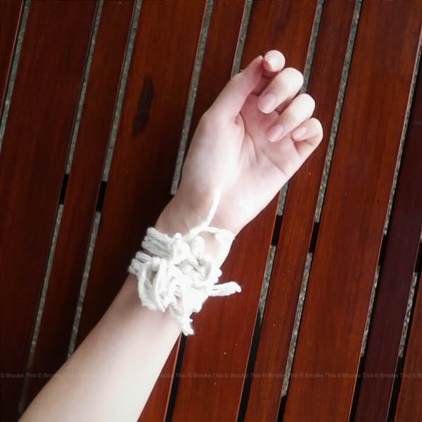 Cotton strings tied around my wrist from a Lao Baci ceremony
