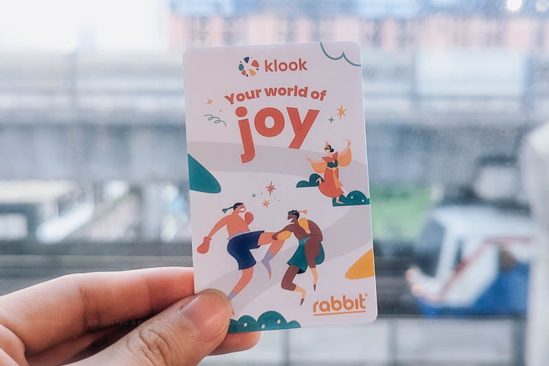 Close-up of a Bangkok BTS Skytrain Rabbit Card with Klook branding